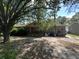 Charming brick home featuring a cozy front porch and mature trees in the front yard at 1022 Miles Jamison Rd, Summerville, SC 29485