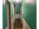 Hallway with green walls and white trim at 1022 Miles Jamison Rd, Summerville, SC 29485
