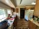 A kitchen featuring a large window and older appliances, with laminate flooring at 1022 Miles Jamison Rd, Summerville, SC 29485