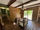 Photo of a room with wood-look floors, ceiling beams, and access to an outside patio at 1022 Miles Jamison Rd, Summerville, SC 29485