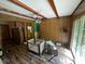 View of a room with wood-look floors, ceiling beams, and access to an outside patio at 1022 Miles Jamison Rd, Summerville, SC 29485