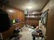 A cluttered storage room with a light and shelving at 1022 Miles Jamison Rd, Summerville, SC 29485