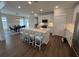 Bright kitchen showcasing a large island, stainless appliances, and an open layout to the dining area at 104 Pine Waters Ln, Summerville, SC 29483
