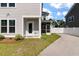 A home with a partially fenced yard with a view of the screened in porch at 104 Pine Waters Ln, Summerville, SC 29483
