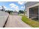 View of the home with detached garage from the backyard, showing a gated drive at 104 Pine Waters Ln, Summerville, SC 29483