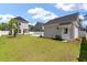 The home has a well manicured backyard with a detached garage at 104 Pine Waters Ln, Summerville, SC 29483