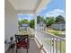 Cozy balcony with a chair overlooks the neighborhood and lush landscaping at 104 Pine Waters Ln, Summerville, SC 29483