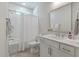 Well-lit bathroom with a tub, modern vanity, and white tile at 104 Pine Waters Ln, Summerville, SC 29483
