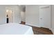 Bright bedroom with white walls and dark flooring, showcasing doorways at 104 Pine Waters Ln, Summerville, SC 29483