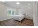 Bright bedroom with a comfortable bed, a large window, and modern lighting at 104 Pine Waters Ln, Summerville, SC 29483