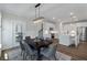 Dining room with a view of the kitchen, table for six and lots of light from the exterior door at 104 Pine Waters Ln, Summerville, SC 29483
