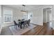 Dining room with lots of light, gray accents, and an aesthetically pleasing light fixture at 104 Pine Waters Ln, Summerville, SC 29483