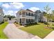 Charming two-story home with a covered porch, black shutters, and a well-manicured lawn at 104 Pine Waters Ln, Summerville, SC 29483