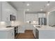 Bright kitchen features stainless steel appliances, white cabinets, subway tile backsplash and a large island with a breakfast bar at 104 Pine Waters Ln, Summerville, SC 29483