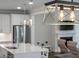 Open concept living area featuring views of the island and stainless steel kitchen at 104 Pine Waters Ln, Summerville, SC 29483