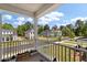 Inviting front porch with white railing provides neighborhood views at 104 Pine Waters Ln, Summerville, SC 29483