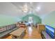 Large bedroom featuring a TV, ceiling fan, couch, and a comfortable bed at 105 Irish Oak Dr, Goose Creek, SC 29445