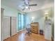 Comfortable bedroom featuring a ceiling fan, light-green walls, and a desk/dresser combination at 105 Irish Oak Dr, Goose Creek, SC 29445