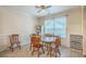 The dining room features a wooden table and chairs, complemented by neutral walls and a ceiling fan for a warm ambiance at 105 Irish Oak Dr, Goose Creek, SC 29445
