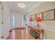 An open foyer with hardwood floors and a console table with decor at 105 Irish Oak Dr, Goose Creek, SC 29445