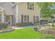 Inviting home featuring well-maintained lawn, garden bed, and seating creating a welcoming entrance at 105 Irish Oak Dr, Goose Creek, SC 29445
