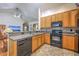 Functional kitchen featuring wood cabinets, tile backsplash and modern appliances at 105 Irish Oak Dr, Goose Creek, SC 29445