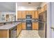 Clean kitchen with wooden cabinets and stainless steel appliances at 105 Irish Oak Dr, Goose Creek, SC 29445