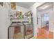 Laundry room features shelving, storage, and stainless-steel washer and dryer at 105 Irish Oak Dr, Goose Creek, SC 29445