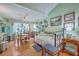 Bright living room with hardwood floors, day bed, and charming decor, blending comfort and style at 105 Irish Oak Dr, Goose Creek, SC 29445