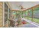 Comfortable screened in porch featuring seating, a ceiling fan, and a view to the outdoors at 105 Irish Oak Dr, Goose Creek, SC 29445