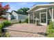 Private backyard with patio, white picket fence, and manicured landscaping at 106 Wrigley Blvd, Summerville, SC 29485