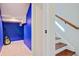 Finished basement with blue accent wall, staircase, and carpeted floor at 106 Wrigley Blvd, Summerville, SC 29485