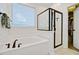 Bright bathroom with a walk-in shower, soaking tub, and a large window at 106 Wrigley Blvd, Summerville, SC 29485