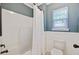 Clean bathroom with bathtub and shower featuring a light filtering window at 106 Wrigley Blvd, Summerville, SC 29485