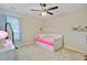 Cozy bedroom with a pink bed, decorated walls, and natural light at 106 Wrigley Blvd, Summerville, SC 29485