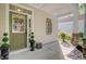 Inviting front porch with stone accents, decorative plants, and a welcoming atmosphere at 106 Wrigley Blvd, Summerville, SC 29485