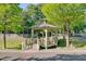 Community gazebo surrounded by trees and grass, great for relaxing at 106 Wrigley Blvd, Summerville, SC 29485