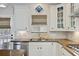 Bright kitchen featuring tile backsplash, stainless steel dishwasher and cabinetry at 106 Wrigley Blvd, Summerville, SC 29485
