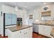 Well-lit kitchen with granite countertops, stainless appliances, and island at 106 Wrigley Blvd, Summerville, SC 29485