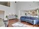 Spacious living room with hardwood floors, high ceilings, and seamless connection to the kitchen area at 106 Wrigley Blvd, Summerville, SC 29485