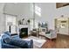 Comfortable living room with a fireplace, natural light, and a welcoming atmosphere for relaxation at 106 Wrigley Blvd, Summerville, SC 29485