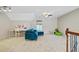 Bright loft area with a comfortable couch, desk, and a window at 106 Wrigley Blvd, Summerville, SC 29485