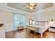 Spacious main bedroom with tray ceiling, hardwood floors, and a cozy window bench at 106 Wrigley Blvd, Summerville, SC 29485