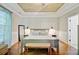 Bright bedroom featuring tray ceilings, wood floors and decorative wall decor at 106 Wrigley Blvd, Summerville, SC 29485