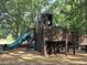 Community playground with wood chip ground cover, towers, and a slide at 106 Wrigley Blvd, Summerville, SC 29485