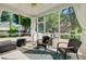 Comfortable screened-in porch with cozy furniture and outdoor view at 106 Wrigley Blvd, Summerville, SC 29485