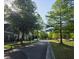 Neighborhood street featuring sidewalks and lush greenery, perfect for leisurely walks at 106 Wrigley Blvd, Summerville, SC 29485