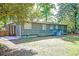 Side view of home from the backyard, showing the patio, siding, windows, and yard space at 108 Helen Dr, Summerville, SC 29483