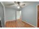 Neutral painted bedroom with hardwood floors, ceiling fan, and ample light at 108 Helen Dr, Summerville, SC 29483