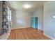 This bright bedroom features hardwood floors and neutral paint at 108 Helen Dr, Summerville, SC 29483